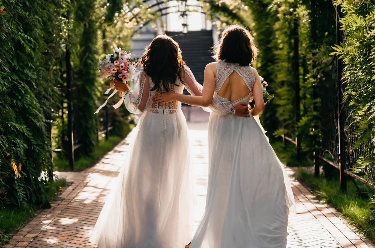 Two brides walking down the aisle