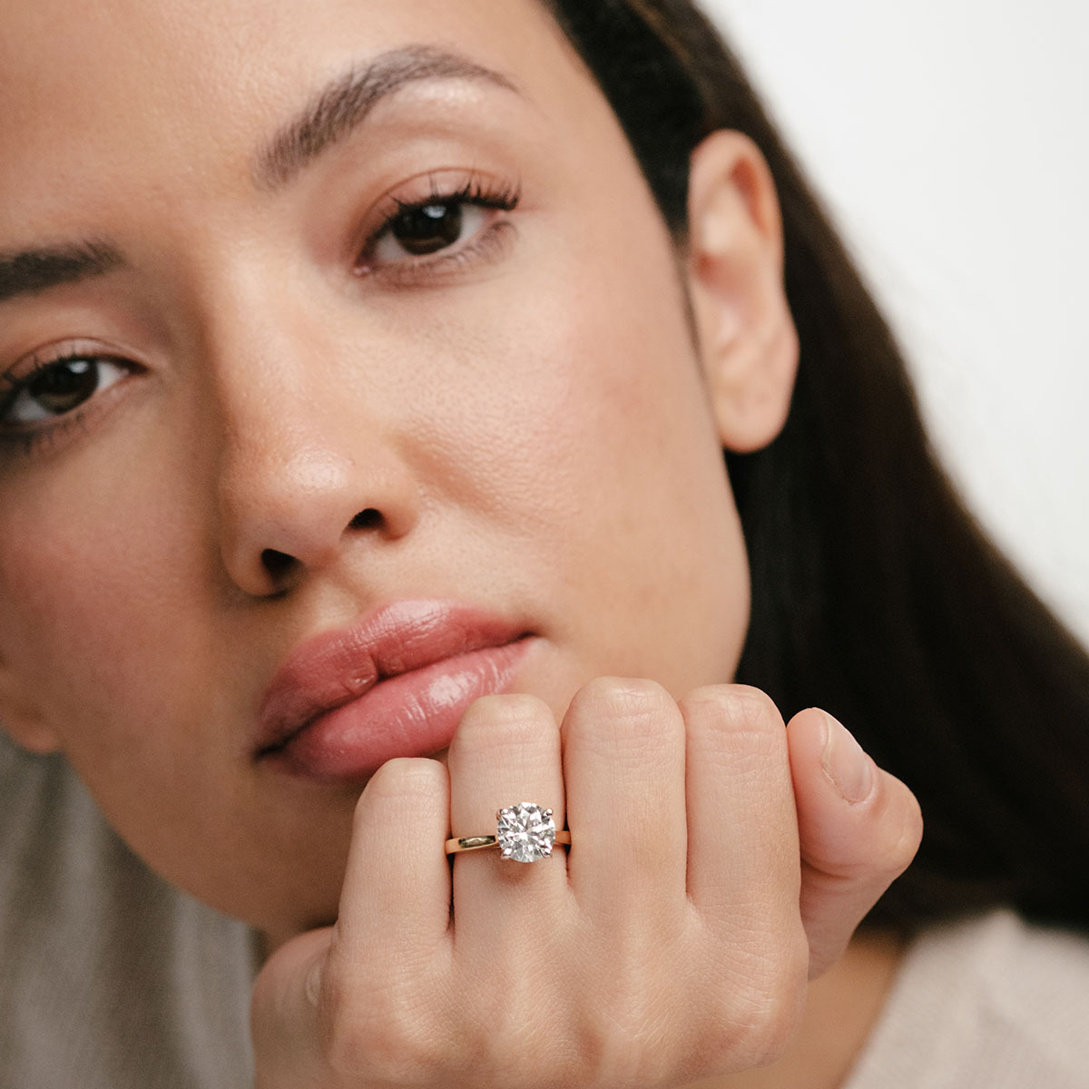 model wearing engagement ring